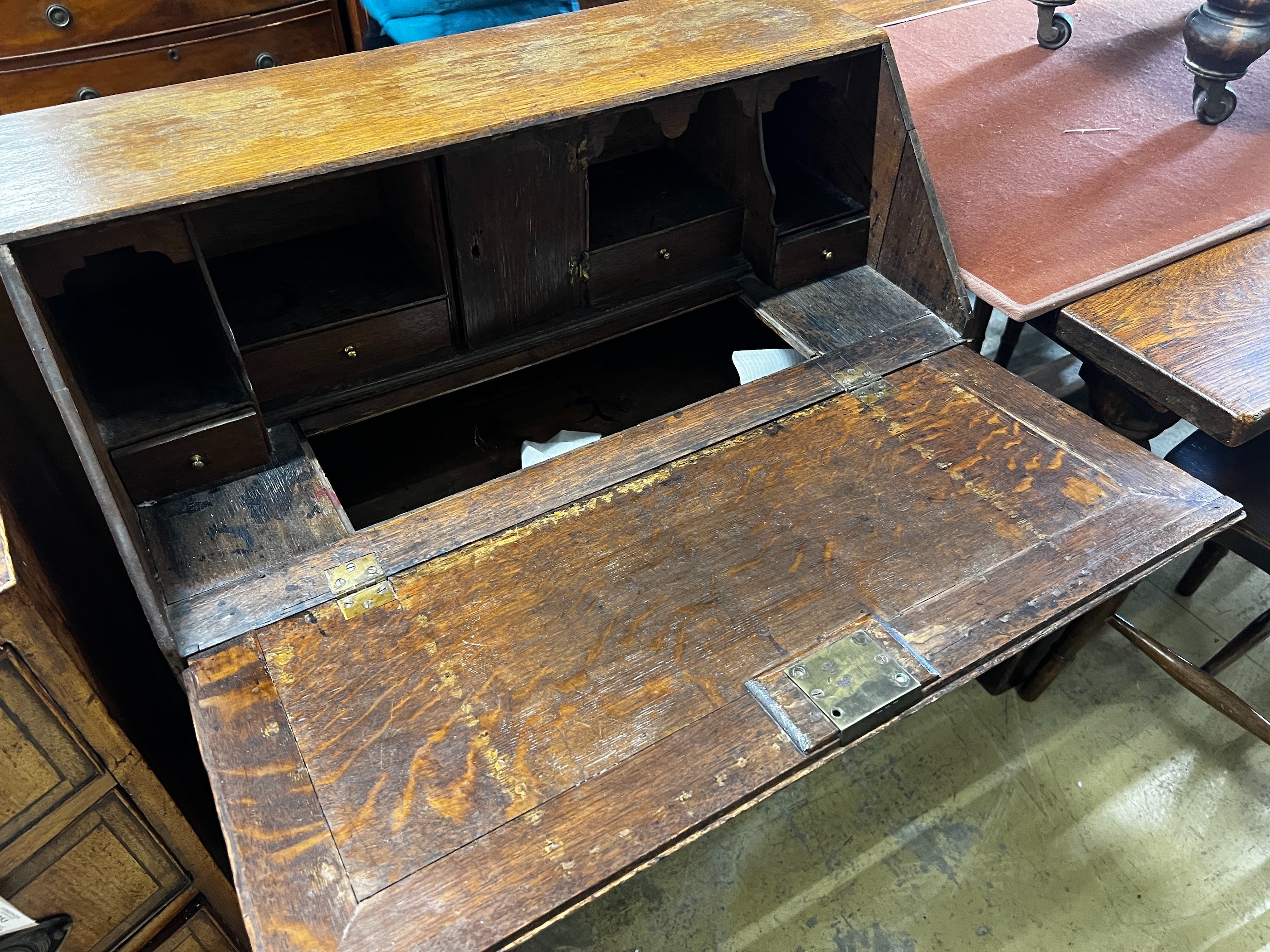 A small 18th century oak bureau, width 76cm, depth 40cm, height 94cm